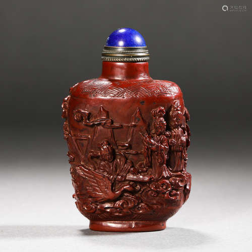 Carved red snuff bottle from the Qing Dynasty