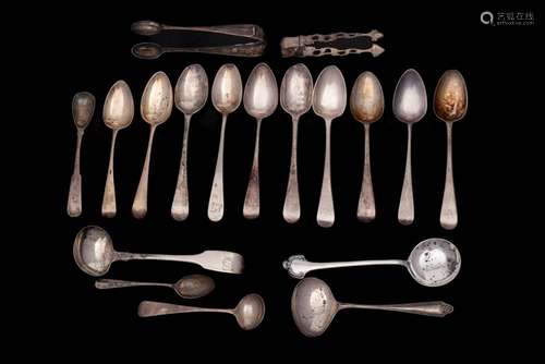 A collection of assorted teaspoons, sugar tongs, mustard spo...