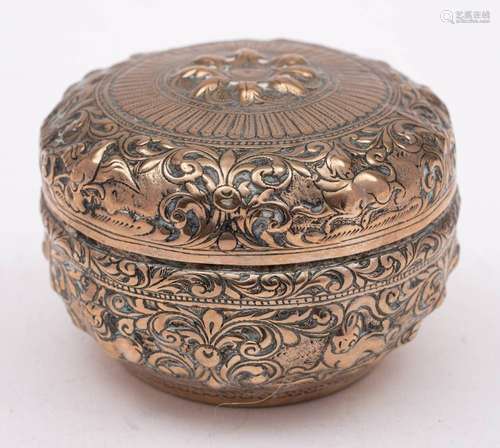 An Indian silver circular box and cover: with embossed anima...