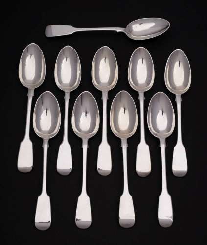 Twelve Victorian silver Fiddle pattern table spoons, maker C...