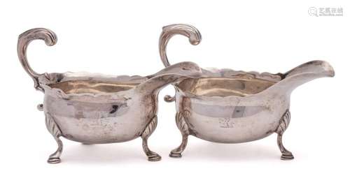 A pair of George II silver sauceboats, makers mark worn, Lon...