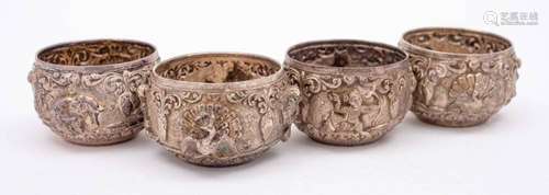 A set of four Burmese silver circular salts: with embossed d...