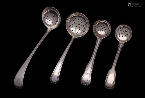 Four assorted silver sifting spoons, various makers and date...