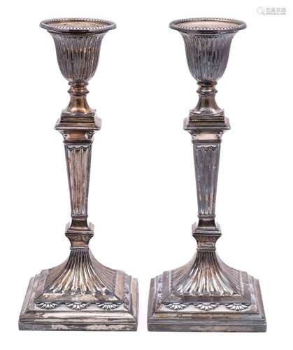 A pair of Victorian silver candlesticks, maker Hawksworth Ey...