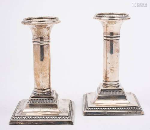 A pair of Edward VII silver desk candlesticks, maker Barker ...