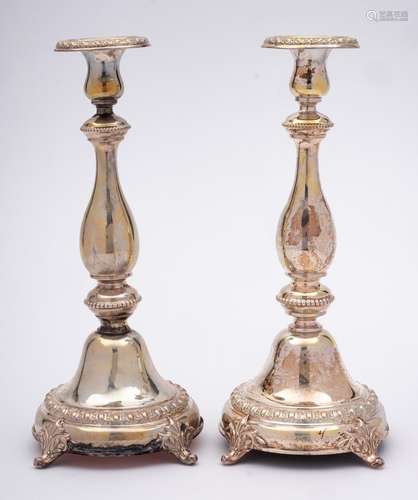 A pair of German silver candlesticks, stamped 880: with urn ...