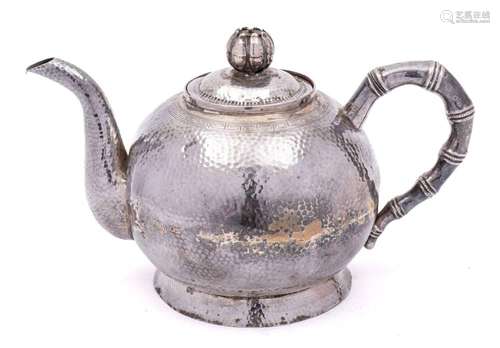 A Chinese hammered silver teapot,