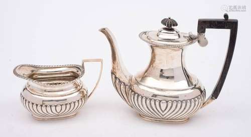 A late Victorian silver coffee pot and cream jug, maker Ford...