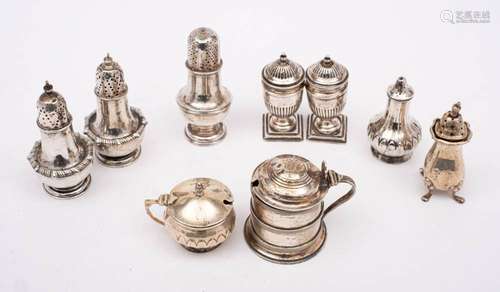 A collection of assorted silver condiments, various makers a...