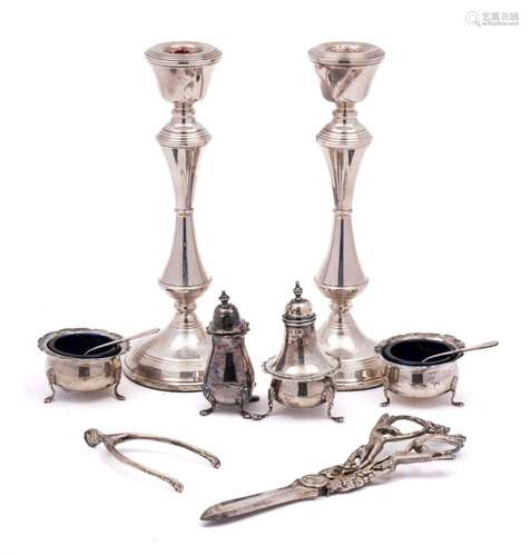 A pair of Elizabeth II silver candlesticks, maker W I Broadw...