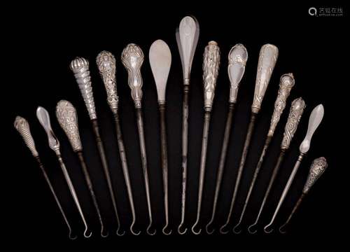 A collection of fifteen assorted silver-handled button hooks...