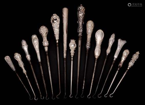 A collection of fifteen assorted silver-handled button hooks...