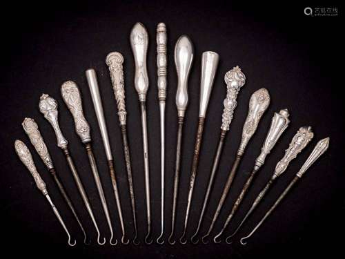 A collection of fifteen assorted silver-handled button hooks...