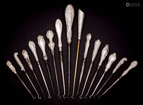 A collection of fifteen assorted silver-handled button hooks...