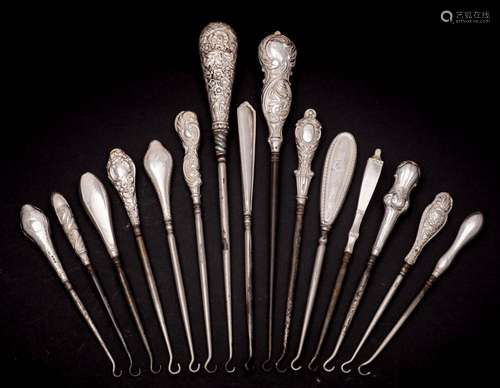 A collection of fifteen assorted silver-handled button hooks...