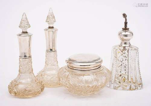 A pair of early 20th century clear cut glass and silver moun...