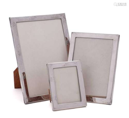 A set of three graduated Sterling silver photograph frames,