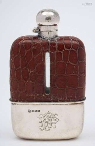 A George V clear glass, leather and silver mounted hip flask...