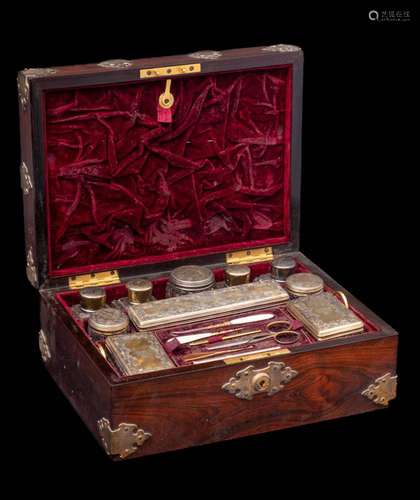 A Victorian rosewood and brass mounted travelling vanity cas...