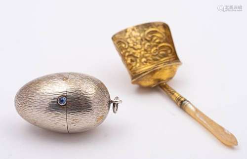 A continental silver cotton reel and needle holder,