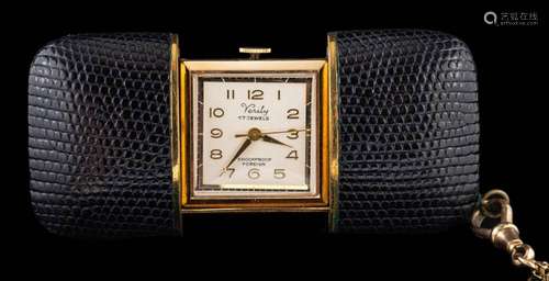 Verity, a travel clock,: in a black case, with a 9 carat gol...