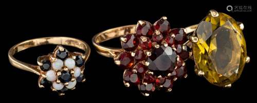 A 9 carat gold garnet cluster ring,: set with circular cut g...