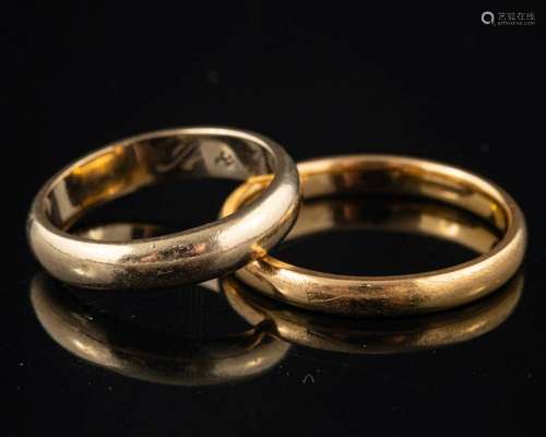 A 22 carat gold ring,: of plain polished form, stamped 22 wi...