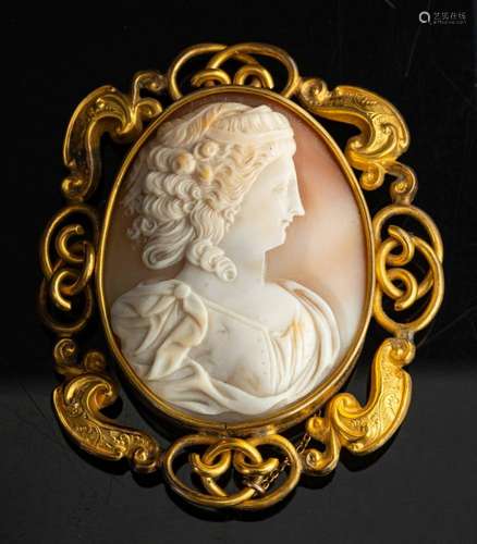 A shell cameo brooch,: the oval shell cameo carved with the ...