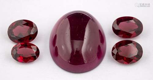 ! A group of loose garnets,: an oval cabochon garnet and thr...