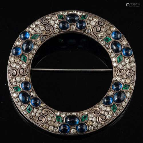 A German 1920s paste brooch,: the circular brooch set with c...