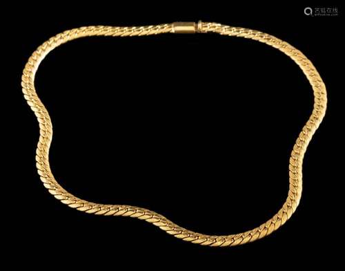 A gold coloured necklace:, the polished curb links to a conc...