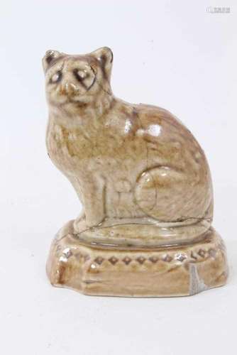 A small lead glazed stoneware model of a cat, circa 1820