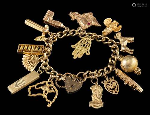 A gold coloured charm bracelet,: the curb link bracelet with...