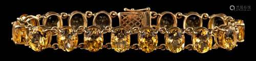 A 9 carat gold citrine bracelet,: set with oval cut citrines...