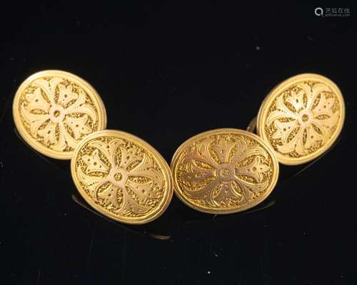 A pair of double sided cufflinks,: the oval panels with engr...