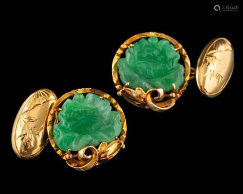 A pair of jade cufflinks,: the carved lotus jade panels with...