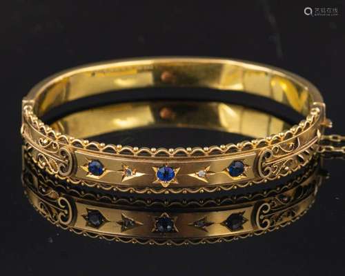 An Edwardian 9ct gold hinged bangle with rose-cut diamonds a...