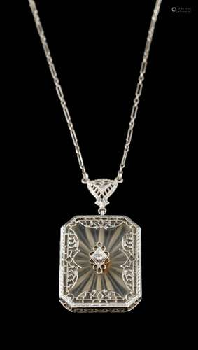 A rock crystal and diamond pendant,