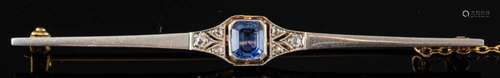 A sapphire and diamond brooch,: the rectangular cut sapphire...