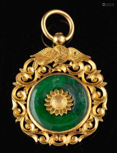 A green hardstone pendant,: the circular green hardstone wit...