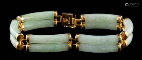 A jadeite bracelet,: stamped 14k, 18.5cm long.