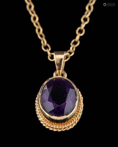 A 9 carat gold amethyst pendant,: the oval cut amethyst in a...