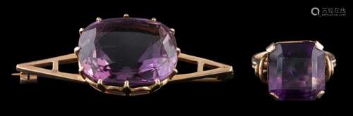 An amethyst brooch: the cushion cut amethyst in a claw setti...