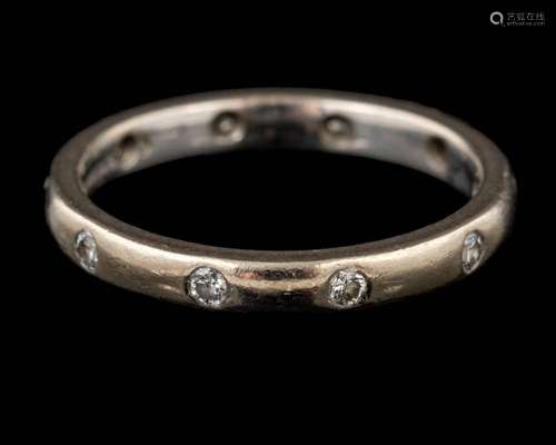 A diamond eternity ring,: set with brilliant cut diamonds,