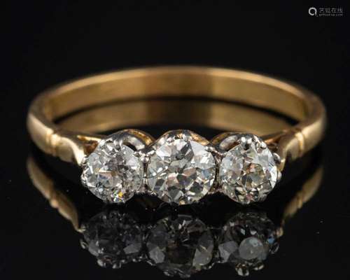 A diamond three stone ring,: set with three old brilliant cu...