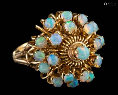 An opal dress ring,: set with a cluster of circular cut opal...