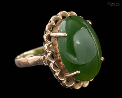 A nephrite ring,: the oval cabochon nephrite in a four claw ...