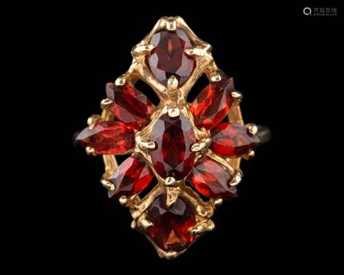 A garnet ring,: set with oval cut marquise cut and pear cut ...