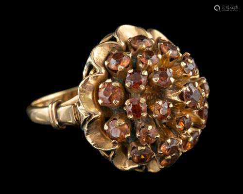 A sunstone dress ring,: set with a cluster of circular cut s...