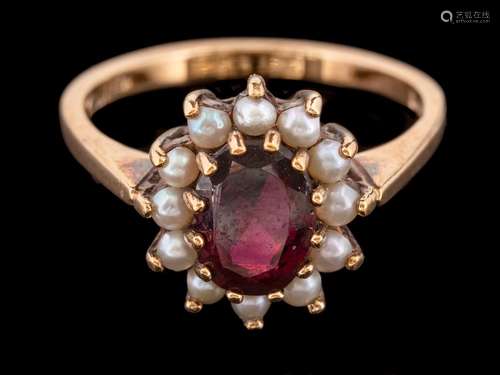 A 9 carat gold garnet and half pearl ring,